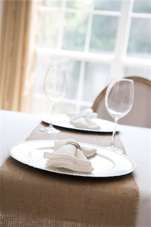 place setting on white - Simple and elegant place setting for two with plate charger and napkin Stock Photo - Premium Royalty-Free, Code: 600-06961841