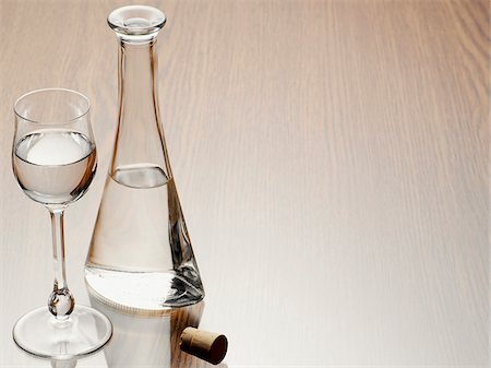 Glass of Grappa with Carafe and Cork, Studio Shot Photographie de stock - Premium Libres de Droits, Code: 600-06961860