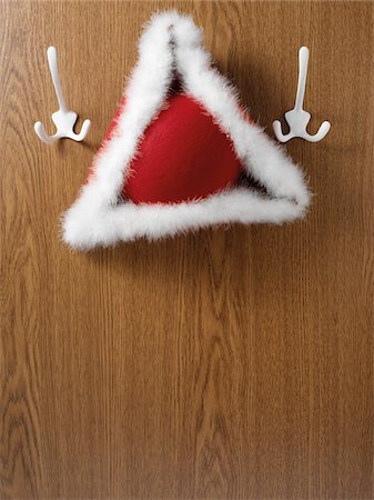 simsearch:600-07110446,k - Tricorne hat hanging on hook, studio shot Photographie de stock - Premium Libres de Droits, Code: 600-07067130