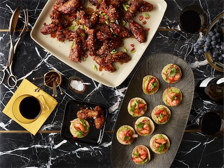 simsearch:600-07311282,k - Overhead View of Appetizers, Chicken Wings and Crostini, Studio Shot Stock Photo - Premium Royalty-Free, Code: 600-07067617