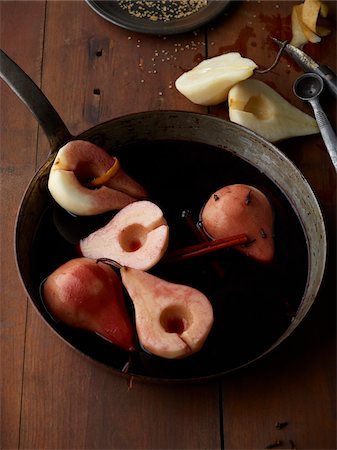 fry pan - Poaching Bosc Pears in Red Wine, Studio Shot Stock Photo - Premium Royalty-Free, Code: 600-07067634