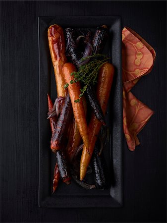 food on black - Overhead View of Plate of Grilled Carrots, Studio Shot Stock Photo - Premium Royalty-Free, Code: 600-07067637
