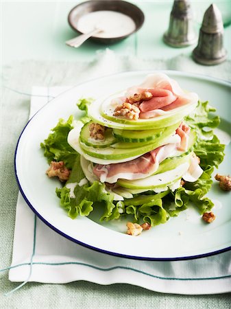 simsearch:600-06892685,k - Plate of Apple and Fennel Salad with Prosciutto and Walnuts, Studio Shot Stock Photo - Premium Royalty-Free, Code: 600-07110418