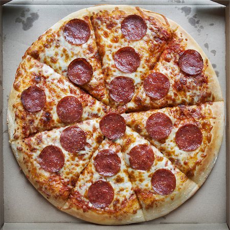 Overhead View of Whole Pepperoni and Cheese Pizza in Cardboard Box Stock Photo - Premium Royalty-Free, Code: 600-07110505