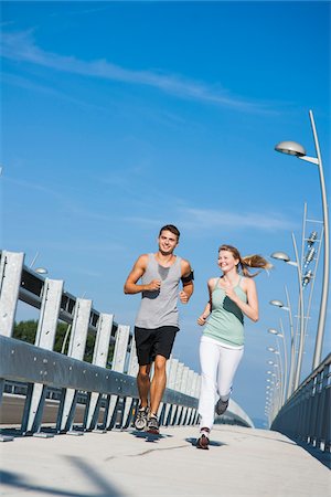 pedometer - Young Couple Running, Worms, Rhineland-Palatinate, Germany Stock Photo - Premium Royalty-Free, Code: 600-07110558