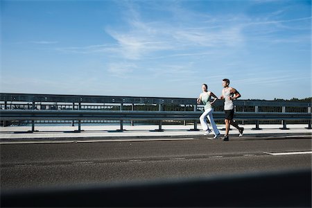 simsearch:600-07110816,k - Young Couple Running, Worms, Rhineland-Palatinate, Germany Stock Photo - Premium Royalty-Free, Code: 600-07110584