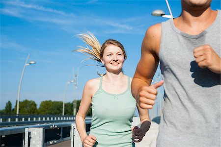 running women pictures - Young Couple Running, Worms, Rhineland-Palatinate, Germany Stock Photo - Premium Royalty-Free, Code: 600-07110582