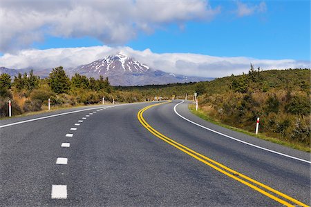 snowcapped mountains with a road - State Highway Road, Mount Tongariro, Tongariro National Park, Waikato, North Island, New Zealand Stock Photo - Premium Royalty-Free, Code: 600-07110718
