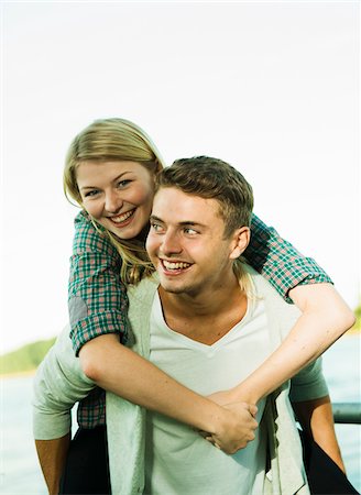 Young Man giving Young Woman Piggyback Ride, Mannheim, Baden-Wurttermberg, Germany Stock Photo - Premium Royalty-Free, Code: 600-07110811