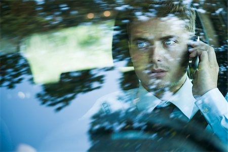 front - Businessman using Cell Phone and Driving, Mannheim, Baden-Wurttemberg, Germany Stock Photo - Premium Royalty-Free, Code: 600-07110826