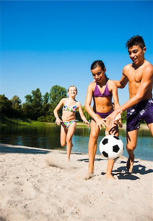 Kids Playing Soccer on Beach by Lake, Lampertheim, Hesse, Germany Stock Photo - Premium Royalty-Free, Code: 600-07148094