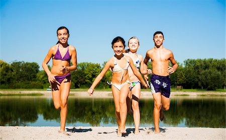 Kids Running on Beach by Lake, Lampertheim, Hesse, Germany Stock Photo - Premium Royalty-Free, Code: 600-07148092