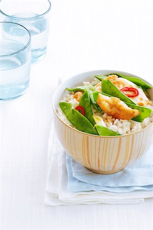 simsearch:600-08002141,k - Chicken stir fry with rice in bowl, studio shot Stock Photo - Premium Royalty-Free, Code: 600-07156119