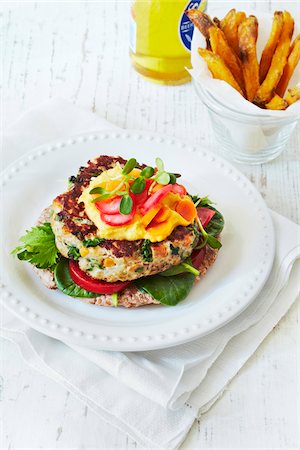 Turkey Burger on plate, sweet potatoe fries and beer, studio shot Stock Photo - Premium Royalty-Free, Code: 600-07156136