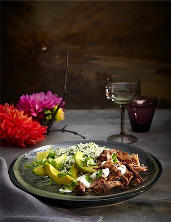 simsearch:600-07067645,k - Pork carnitas with herb rice on plate, Mexican Fiesta, studio shot Stock Photo - Premium Royalty-Free, Code: 600-07156159