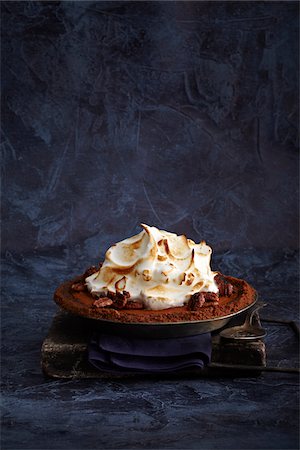 pecan pie - Pumpkin Pie with gingersnap crust in pie plate, studio shot Stock Photo - Premium Royalty-Free, Code: 600-07156161