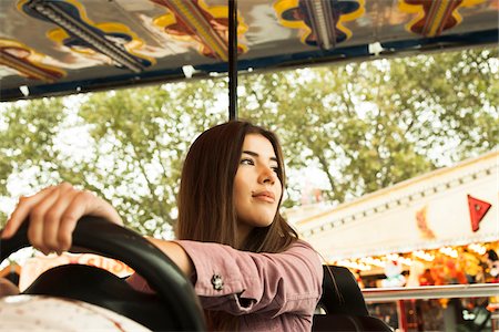 Portrait of Young Woman at Amusement Park, Mannheim, Baden-Wurttermberg, Germany Stock Photo - Premium Royalty-Free, Code: 600-07156264