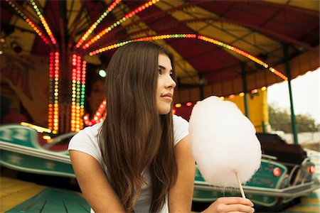 european candy - Portrait of Young Woman at Amusement Park, Mannheim, Baden-Wurttermberg, Germany Stock Photo - Premium Royalty-Free, Code: 600-07156276