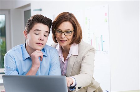 eyeglasses teenager boy - Business People in Office, Mannheim, Baden-Wurttemberg, Germany Stock Photo - Premium Royalty-Free, Code: 600-07199425