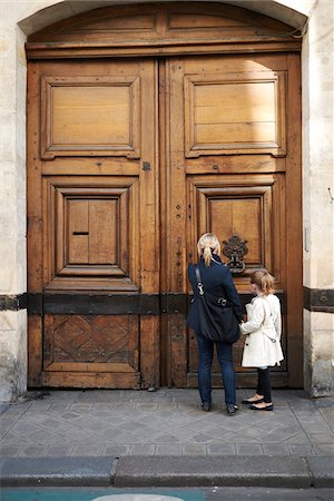 europe trip - Mother and Daughter at Doorway, Paris, France Stock Photo - Premium Royalty-Free, Code: 600-07199700