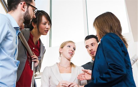 Group of young business people and businesswoman in discussion in office, Germany Photographie de stock - Premium Libres de Droits, Code: 600-07199946