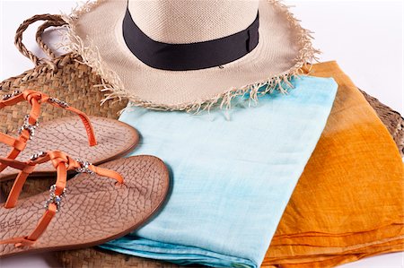 Colorful Summer Clothes and Accessories, Panama Hat, Beach Bag, Flip Flops and Sarongs Stock Photo - Premium Royalty-Free, Code: 600-07192124