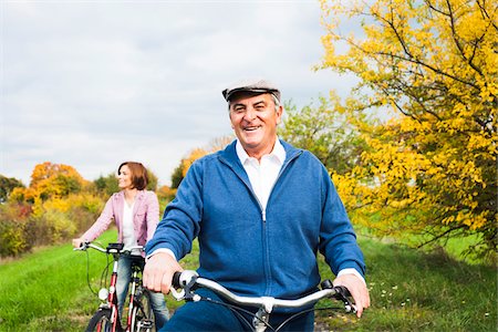 senior couple riding bicycles - Couple Riding Bicycles in Autumn, Mannheim, Baden-Wurttemberg, Germany Stock Photo - Premium Royalty-Free, Code: 600-07192138