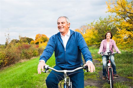 senior couple riding bicycles - Couple Riding Bicycles in Autumn, Mannheim, Baden-Wurttemberg, Germany Stock Photo - Premium Royalty-Free, Code: 600-07192139