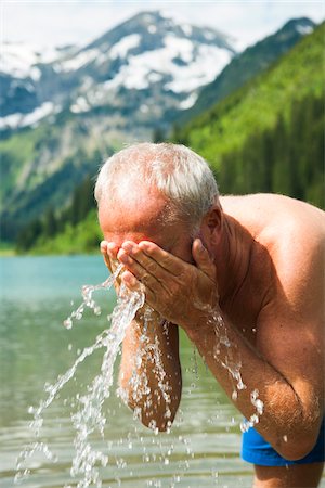 reutte district - Mature Man Splashing Water on Face, Vilsalpsee, Tannheim Valley, Tyrol, Austria Stock Photo - Premium Royalty-Free, Code: 600-07192157