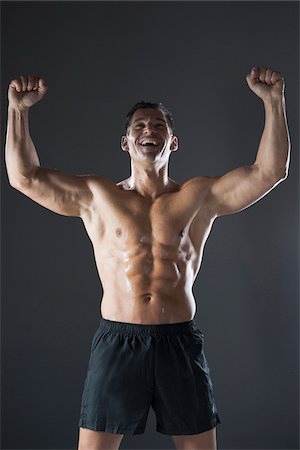 physique - Portrait of Fit Man Cheering, Studio Shot Stock Photo - Premium Royalty-Free, Code: 600-07192167