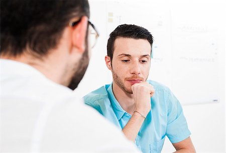 staff discussion - Close-up of two young businessmen meeting and in discussion, Germany Stock Photo - Premium Royalty-Free, Code: 600-07200034