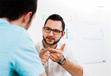 Close-up of two young businessmen meeting and in discussion, Germany Stock Photo - Premium Royalty-Free, Code: 600-07200035