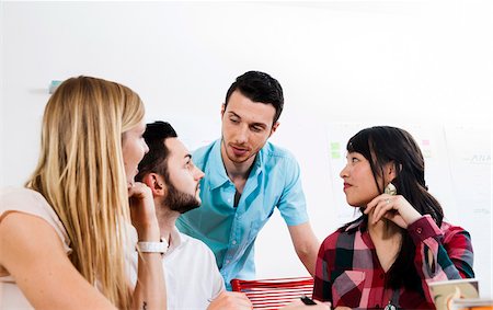 simsearch:600-07200043,k - Group of young business people meeting and in discussion in office, Germany Stock Photo - Premium Royalty-Free, Code: 600-07202771