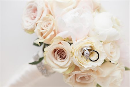 Close-up of Rings in Bouquet of Roses, Studio Shot Stock Photo - Premium Royalty-Free, Code: 600-07237575