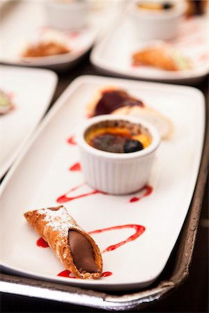 dessert plate garnish - Chocolate Cannoli and Creme Brulee for Dessert at Wedding Stock Photo - Premium Royalty-Free, Code: 600-07237822