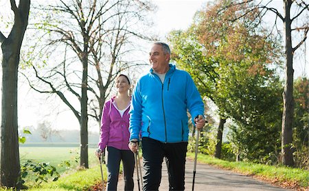 senior man exercising - Couple Nordic Walking Outdoors, Mannheim, Baden-Wurttemberg, Germany Stock Photo - Premium Royalty-Free, Code: 600-07237877