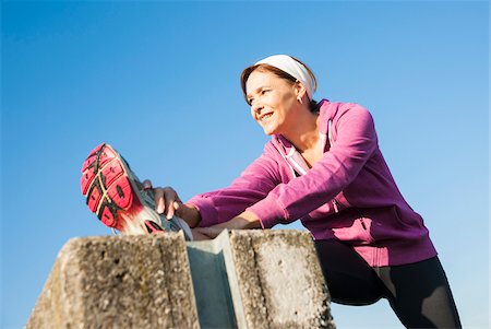 simsearch:600-07237885,k - Mature Woman Stretching Outdoors, Mannheim, Baden-Wurttemberg, Germany Stock Photo - Premium Royalty-Free, Code: 600-07237889