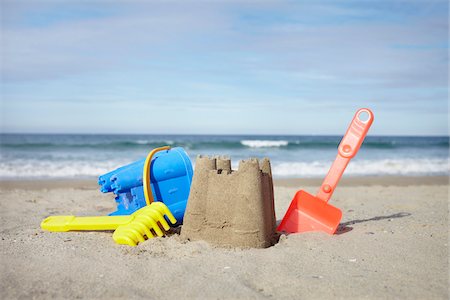 pail - Beach Toys and Sand Castle at Beach, Saint-Jean-de-Luz, Pyrenees-Atlantiques, France Stock Photo - Premium Royalty-Free, Code: 600-07279376
