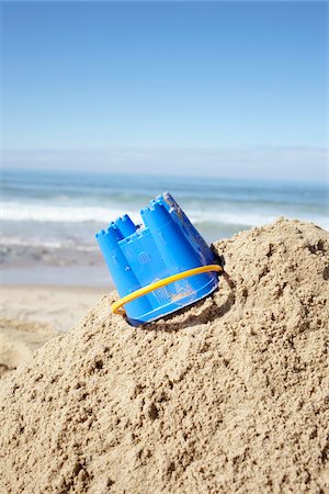 simsearch:600-06407677,k - Toy Bucket and Sand Castle at Beach, Biarritz, Pyrenees-Atlantiques, France Stock Photo - Premium Royalty-Free, Code: 600-07279373