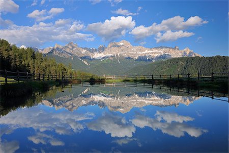 dolomites - Rosengarten (Catinaccio Group) Mountains Reflecting in Lake, Kesselkogel, Vajolet Towers, Laurinswand and Rosengartenspitze, near village of Tiers, Wuhnleger Area, Trentino-Alto Adige, Dolomites, Italy Stock Photo - Premium Royalty-Free, Code: 600-07288047