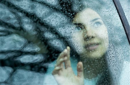 Young Woman in Car on Rainy Day, Mannheim, Baden-Wurttemberg, Germany Stock Photo - Premium Royalty-Free, Code: 600-07310954