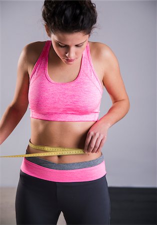 stomach (upper abdomen) - Portrait of Teenager Measuring Waist Stock Photo - Premium Royalty-Free, Code: 600-07310969