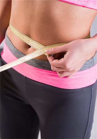 Close-up of Teenager Measuring Waist Foto de stock - Sin royalties Premium, Código: 600-07310972