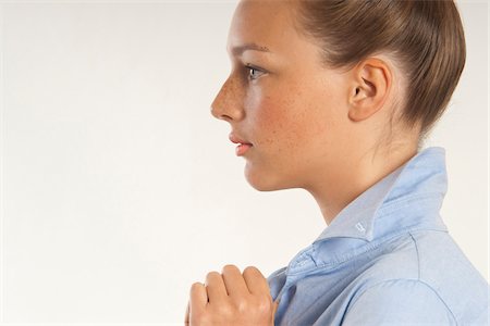 simsearch:700-03848894,k - Close-up portrait of young woman, profile, studio shot on white background Stock Photo - Premium Royalty-Free, Code: 600-07348156