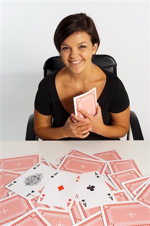female only (human) - Mid-Adult Woman doing Magic Trick with Deck of Cards Stock Photo - Premium Royalty-Free, Code: 600-07355325