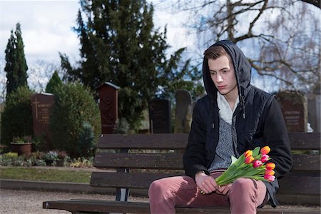 flower dying - Teenager Sitting on Bench in Cementery Stock Photo - Premium Royalty-Free, Code: 600-07351350