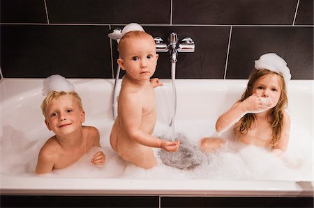 sitting girl - Three Children having Bath in Bathtub Stock Photo - Premium Royalty-Free, Code: 600-07434963