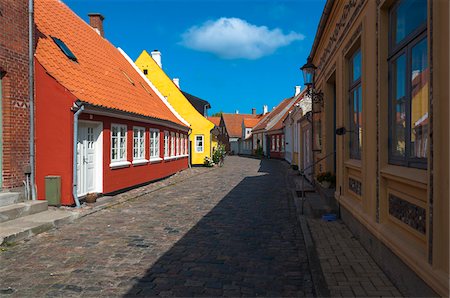 Typical painted houses and Cobblestone Street, Aeroskobing Village, Aero Island, Jutland Peninsula, Region Syddanmark, Denmark, Europe Stock Photo - Premium Royalty-Free, Code: 600-07451021