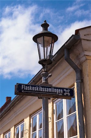 Close-up of Lamppost and Street Sign, Flaskeskibssamlingen (museum) Aeroskobing, Aero Island, Jutland Peninsula, Region Syddanmark, Denmark, Europe Stock Photo - Premium Royalty-Free, Code: 600-07451031