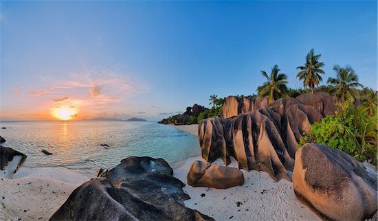 Rock Formations and Palm Trees at Sunset, Anse Source d´Argent, La Digue, Seychelles Stock Photo - Premium Royalty-Free, Artist: Martin Ruegner, Image code: 600-07453854
